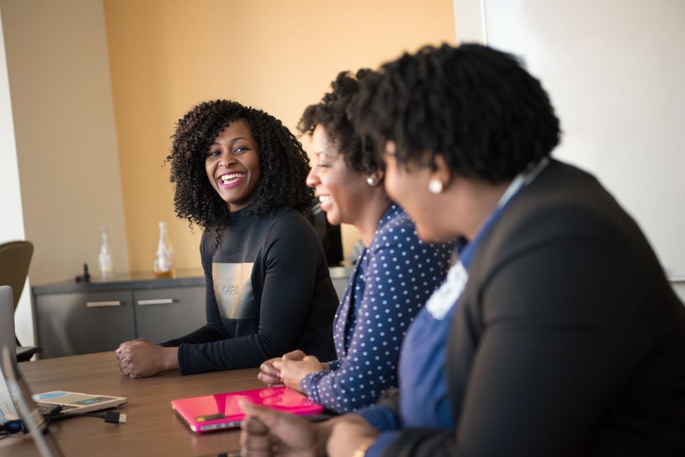 Employees in a meeting room.