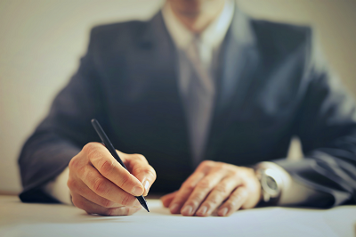 An executive wearing a suit and tie.