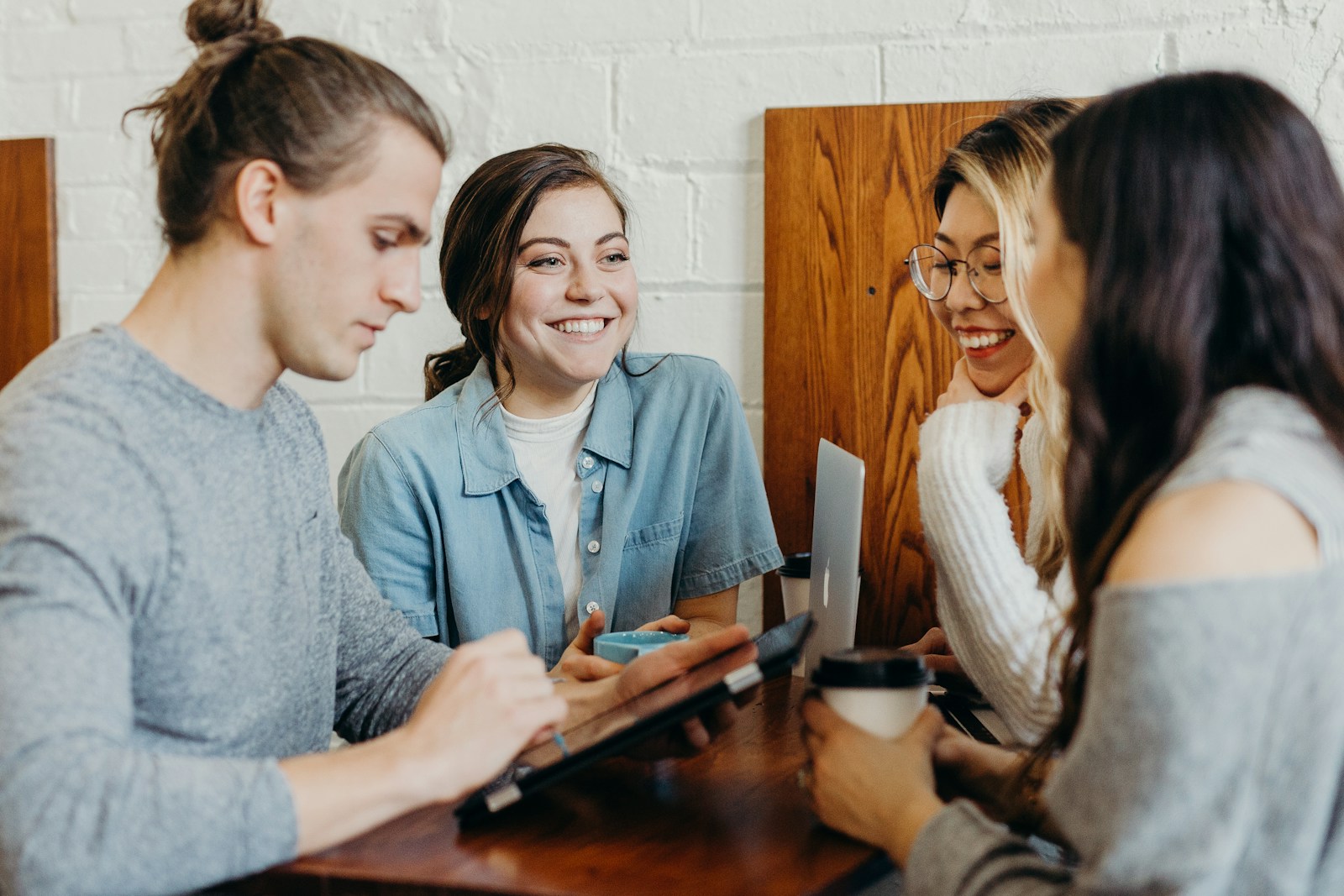 A group of friends at a coffee shop or a group of employees with the best health insurance provided