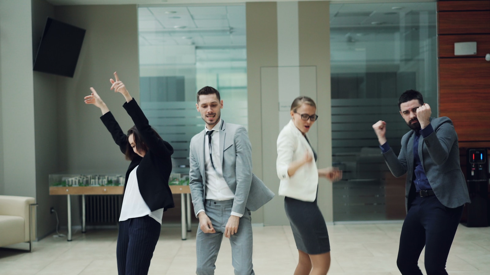 Business people celebrating and dancing in office
